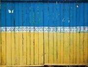 yellow and blue wooden fence